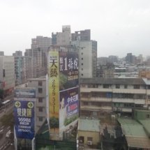 A view of some large billboards in a city.